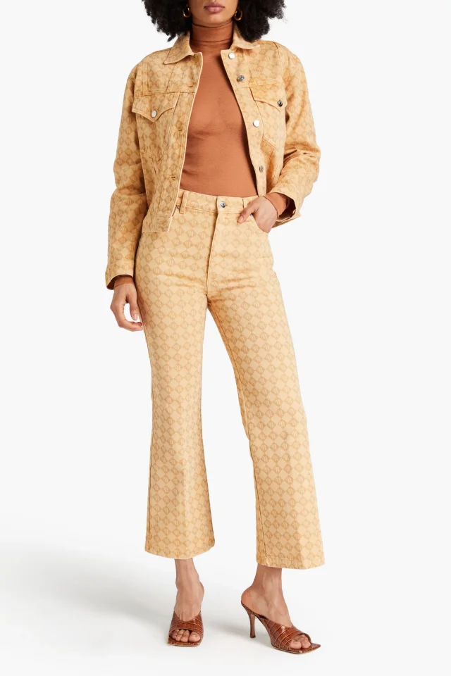 Nanushka Logo-Print High-Rise Kick-Flare Jeans in Sand, photo 2 of 4 from THE OUTNET