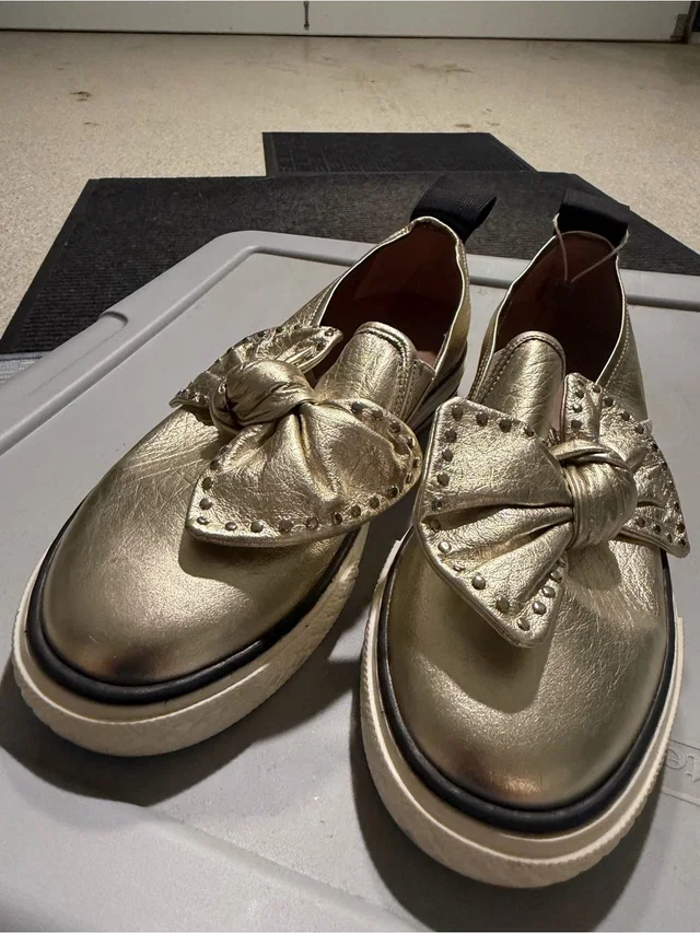 REDValentino Metallic Gold Bow Platform Loafers in gold from Poshmark