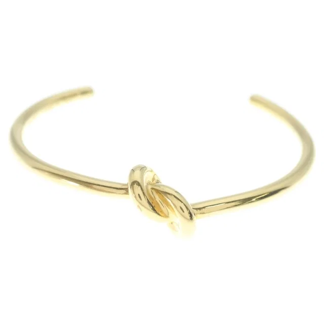 Celine Knot Extra Thin Bracelet Bangle Plated Gold in Gold from The Reluxe