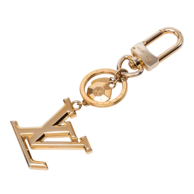 Gold Louis Vuitton Gold Plated LV Facettes Bag Charm and Key Holder in Gold from Designer Revival