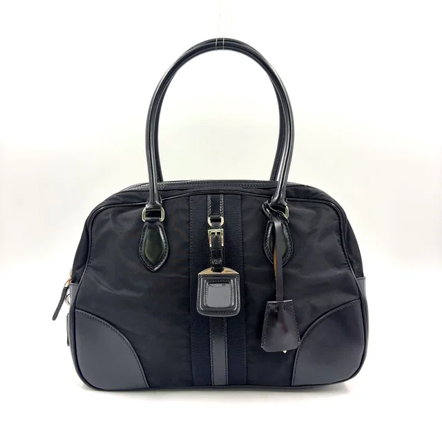 Prada Triangle Logo Nylon Bowling Bag Leather Black Mini Silver in Black Nylon from The Reluxe