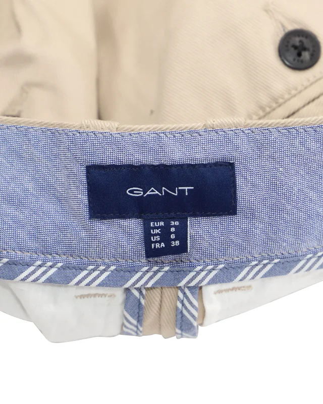 Gant High-Waisted Crest Embroidery Pleated Chinos in Beige Print Cotton in Beige, photo 5 of 6 from ShopSimon