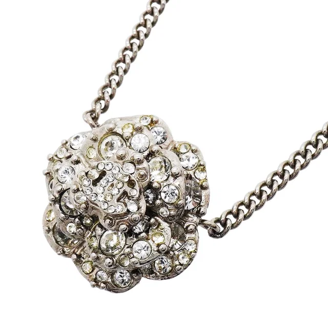 Chanel Necklace CC Logo Camellia Metal Rhinestone Silver in Silver from The Reluxe