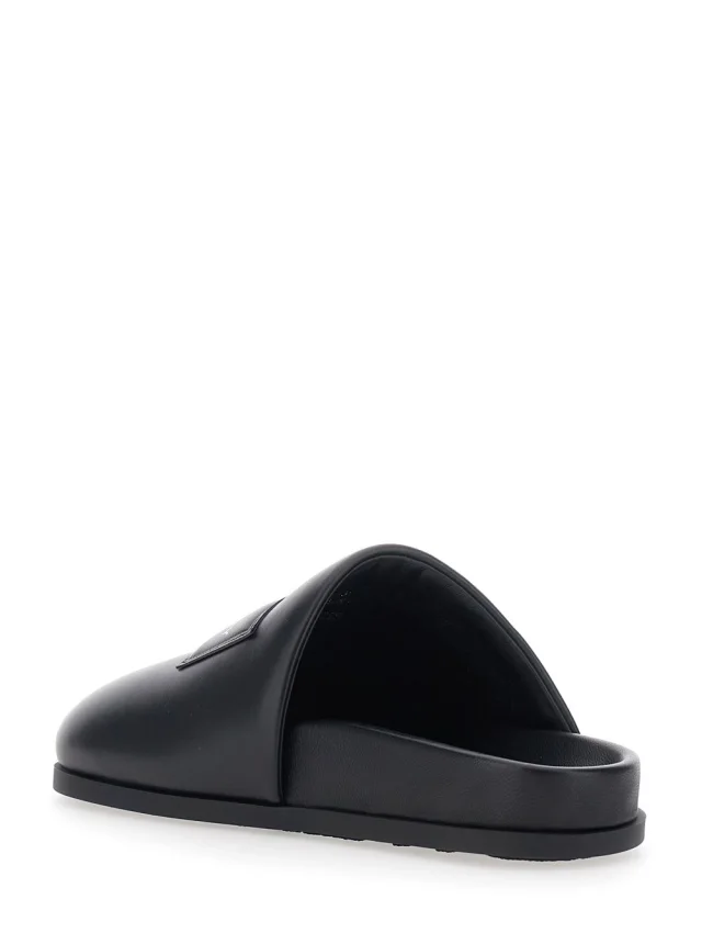 GIVENCHY Black Mules with Asymmetrical Design and Padded Leather Logo Women in Black 100% Lamb, photo 5 of 8 from Gaudenzi Boutique